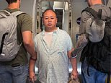 Pedophile migrant is seen being marched onto plane by ICE after Minnesota Governor Tim Walz pardoned him to try and keep him in the US