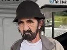 Dubai ruler Sheikh Maktoum looks glum as he arrives in Scottish Highlands with 60-car convoy to celebrate his 77th birthday