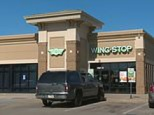 Parents leave six kids, including two INFANTS, in car on sweltering day to scarf chicken wings