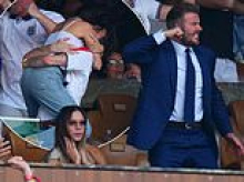 David Beckham roars as he celebrates England World Cup victory with Victoria and their children