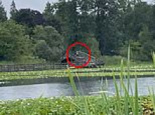 Vile woman caught dumping huge bag of trash into stunning lake filled with ducks... before being extremely rude to onlooker who confronted her