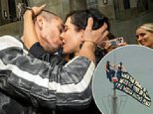 Couple arrested for illegal climb to top of Empire State Building put on VERY amorous display at latest court appearance while wearing utterly shameless jewelry