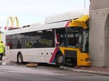 Driver seriously injured after bus crashed into a rail bridge, trapping him in the wreckage