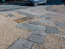 Council criticised over 51 'patchwork' pothole repairs along ONE road