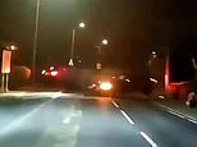 Moment family in taxi is hit on their way home from airport by reckless driver who careers round corner on wrong side of the road 