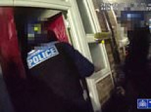 Watch the moment armed police use circular saw to break down suspected knife smuggler's door in dawn raid