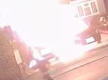 Moment idiot arsonist sets himself on fire as he torches two cars in the middle of the night