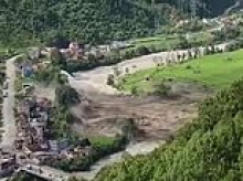 Entire town obliterated in seconds: Dramatic footage shows furious floodwaters wiping out buildings in Nepal as dozens of Aussies remain missing