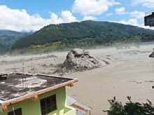 Astonishing new footage emerges from Nepal - with bus-sized 'boulder' pushed by floodwaters to last-second escapes from tsunami
