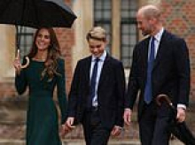 Prince George's first day at Eton: King-in-waiting poses in his new school uniform after arriving with proud Prince and Princess of Wales by his side