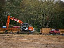 Travellers are ordered to leave illegal site opposite Britain's nuclear weapons factory where they built 13 static homes