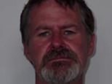 Man accused of brutally attacking his elderly parents and brother with an axe is finally arrested after four-day manhunt
