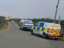 Boy, 15, is found dead ten days after being swept out to sea with his father and brother at popular Welsh tourist beach