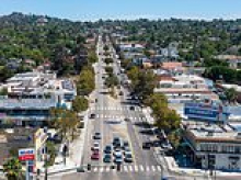 Locals in charming California town furious over plans to create busy Olympic bus lane in the middle of their community