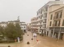 Woman drowns after falling over in a flooded street and getting trapped under a car as torrent rushed through in Majorca