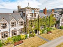 One of UK's oldest private schools once attended by John Lennon's son is put up for sale for £5million after shock closure