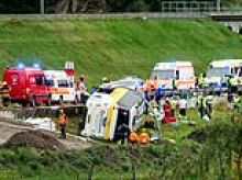 Several dead after tourist coach carrying 48 passengers flips over mountain road in Swiss Alps
