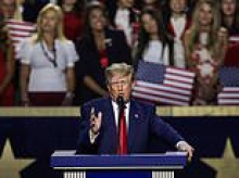 Trump calls himself the 'greatest president in history' as he leads fawning crowd in rambling pledge... while threatening that Americans will go to HELL if they don't vote Republican