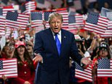 Inside Trump's Dallas bubble where the faithful shrug off war and beg for MORE as the GOP braces for coming bloodbath
