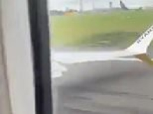 Moment Ryanair passengers scream as Boeing jet's wing clips runway during aborted landing in Ireland