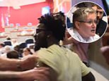 Furious resident is slammed to the ground and arrested during tense council meeting after 'laughing at the wrong time'