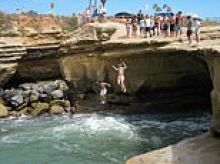 Teenagers left with life-threatening injuries after cliff diving in ritzy Californian town goes horribly wrong - as locals call for rite-of-passage to end