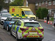 Woman, 40, is arrested over 'acid attack' as 40-year-old man is rushed to hospital and road closed