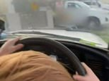 Disturbing moment toddler allegedly steers ute down a suburban street as man is charged after egging on the boy: 'Don't crash'