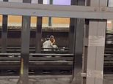 Shocking video shows man and woman casually sitting on subway tracks before being instantly killed when train barrels into station