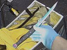 Moment delivery rider was caught with six inch knife after he was stopped by police when he ran a red light