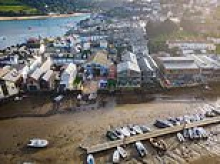 Developer goes bust after losing bid to overturn second homes rule in seaside town dubbed Chelsea-on-Sea - as £1.2million flats it built remain empty for more than a year