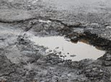Forget ice and rain, now the sun causes potholes as well! RAC warns Britain's motorists could see surge in craters on the roads caused by hottest summer on record