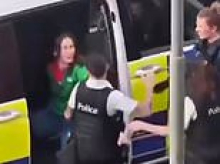 Belgian police officer is filmed brutally slapping handcuffed woman across the face during arrest in case that has sparked fury