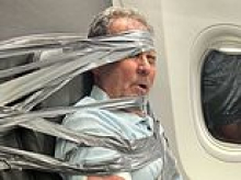 Plane passenger from hell who had to be DUCT-TAPED to his seat after mile-high meltdown breaks his silence