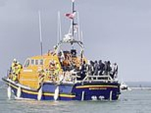 RNLI temporarily suspends services in Portsmouth after its volunteers were abused by anti-migrant protesters