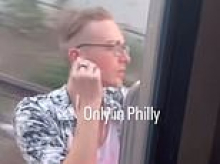 Idiot man in Hawaiian shirt seen enjoying the breeze as he rides OUTSIDE Philadelphia train traveling at high speed
