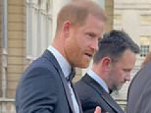 Moment Harry ignores question about Earl Spencer's book but admitted his first two weeks back in UK have been 'eventful' amid war of words between the King and Diana's brother