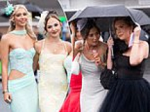 Keep your Ayr on, ladies! Thousands dress to the nines for Gold Cup... but have to battle the weather