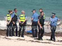 Desperate search for swimmer, 63, killed in horror shark attack at Sorrento Beach enters second day as weather hampers crews