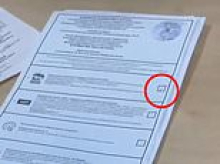 Russian voters are handed ballot papers with an X already marked in favour of Putin's party as elections are hit by mass fraud claims