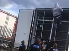 Moment seven migrants are found hiding in back of a lorry as people traffickers turn away from small boats in favour of HGVs to get into UK