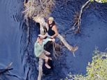 Florida men cling to tree over alligator-infested waters after capsizing boat