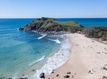 Swimmer dies after surfers find him unresponsive in the water at popular NSW beach