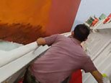 Moment 750ft cargo ship slams into a fishing vessel leaving crew clinging on for their lives on submerged deck