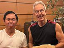 Tony Blair commits to new arms race: Former Prime Minister, 73, shows off buff physique as he hits the gym in Indonesia