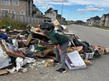 Fury as new residents in Canadian neighborhood are accused of creating squalid 'community garbage pile' that just keeps growing