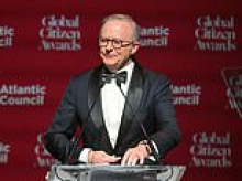 Anthony Albanese accepts global citizen award after bold reporter asked if he truly deserved the honour and Aussies lost it at him: 'Worst PM'