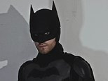 Holy handbags! Partygoer dressed as Batman saves the day when he catches bag snatcher in the street