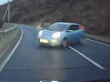 Terrifying moment out-of-control car smashes into driver in head-on crash after hurtling around bend