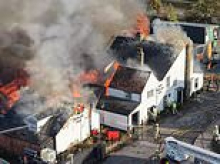 Centuries-old Grade II-listed pub where Pepys and Defoe drank burns down in 'heartbreaking' fire as man in his 20s is arrested for arson